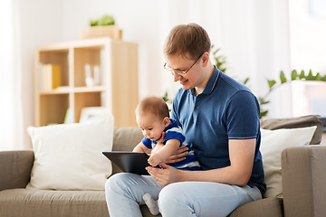 Image showing happy father and baby son with tablet pc at home