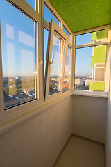 Image showing A small glazed balcony in the apartment of a multi-storey residential building