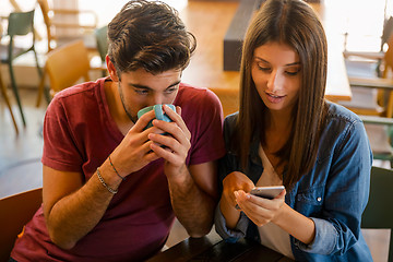 Image showing Friends watching something on the phone