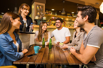 Image showing Talking to the waitress