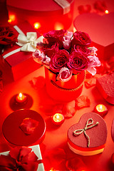 Image showing Valentines day romantic decoration with roses, boxed gifts, candles