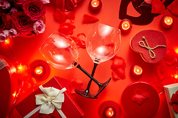 Image showing Valentines day romantic decoration with roses, wine glasses, boxed gifts, candles