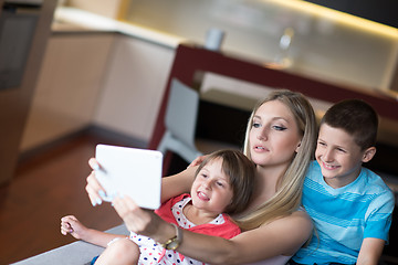 Image showing Young Family Using A Tablet To Make Future Plans