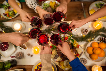 Image showing close up of friends with wine celebrate christmas