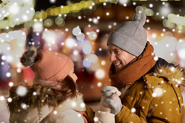 Image showing happy couple holding hands at christmas market