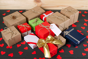 Image showing Gift boxes on wooden table