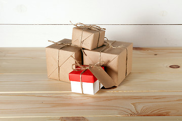 Image showing Gift boxes on wooden table