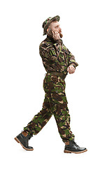 Image showing Young army soldier wearing camouflage uniform isolated on white