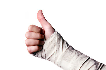 Image showing Images showing hand in a bandage with a thumbs up