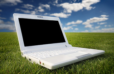 Image showing white laptop in nature