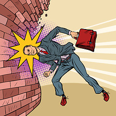 Image showing businessman breaks the wall with his head