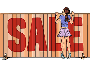 Image showing woman looks over the fence. sale house real estate