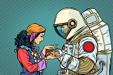 Image showing The fortune teller, and an astronaut. Palmistry by hand