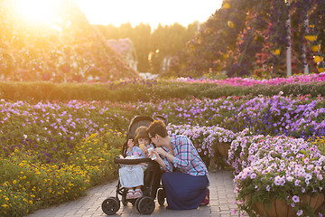 Image showing mother and daughter in flower garden