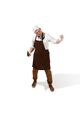 Image showing Angry aggressive butcher posing with a cleaver isolated on white background