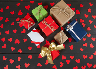 Image showing Gift boxes on wooden table