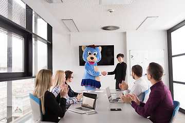 Image showing boss dresed as bear having fun with business people in trendy of