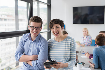 Image showing Two Business People Working With Tablet in office