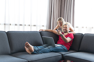 Image showing happy couple relaxes in the living room