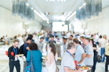 Image showing Blured image of businesspeople at coffee break at conference meeting.