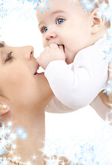 Image showing happy mother playing with baby boy