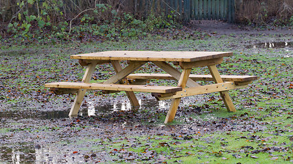 Image showing Wooden picknickplace on a green field