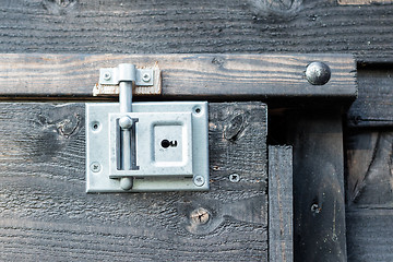 Image showing Wrought iron lock old wooden door