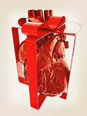 Image showing Red human heart with ribbon. Donor concept. 3d illustration. Vin