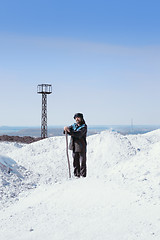 Image showing Man In Ethnic Clothes Among The White Mounds Against The Mining 