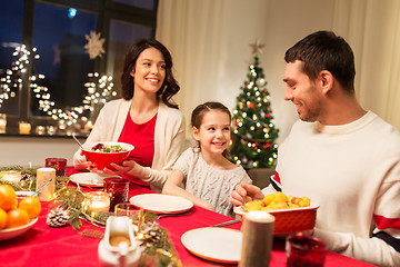 Image showing happy family having christmas dinner at home