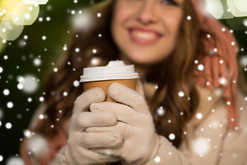 Image showing happy woman with coffee over christmas lights