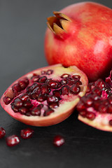 Image showing close up of pomegranate on stone table