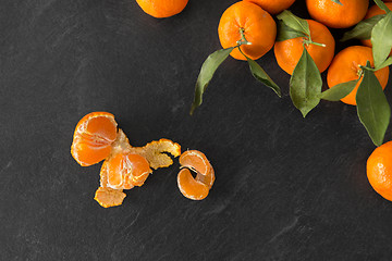 Image showing close up of mandarins on slate table top