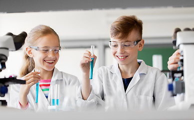 Image showing kids with test tubes studying chemistry at school