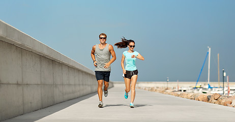 Image showing couple in sports clothes running outdoors