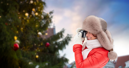 Image showing woman with camera over christmas tree in tallinn