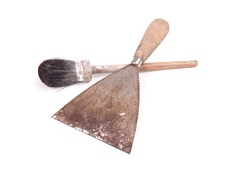 Image showing Old paintbrush with a putty knife