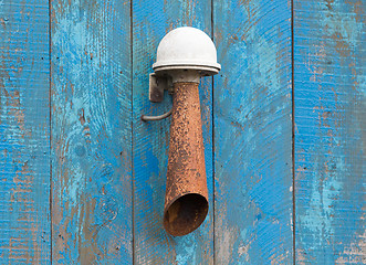 Image showing Alarm horn hanging on a blue wall