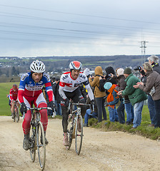 Image showing Two Cyclists on a Dirty Road - Paris-Nice 2016