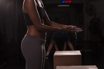 Image showing black woman preparing for climbing workout