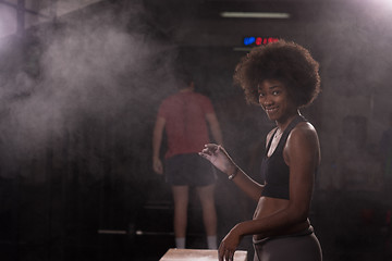 Image showing black woman preparing for climbing workout