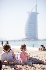 Image showing Mom and daughter on the beach