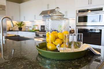 Image showing Abstract of Interior Kitchen Counter with Lemon Filled Pitcher a