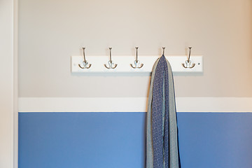 Image showing Wall in House with Scarf Hanging on Coat Rack Hooks Abstract