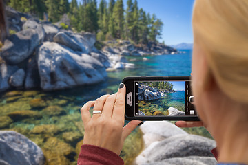 Image showing Woman Taking A Beautiful Lake Picture with Her Smart Phone