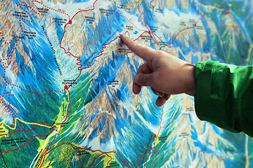 Image showing Finger pointing on a trekking map