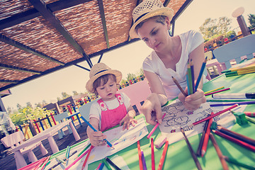 Image showing mom and little daughter drawing a colorful pictures