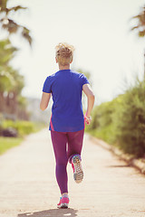 Image showing young female runner training for marathon