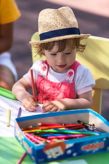 Image showing little girl drawing a colorful pictures