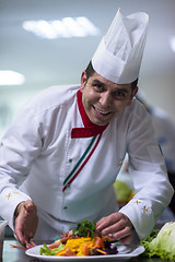 Image showing chef serving vegetable salad